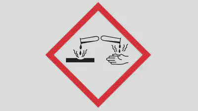 Hazard symbol meaning corrosive - for strong and concentrated acids and alkalis that can eat away metal and skin.